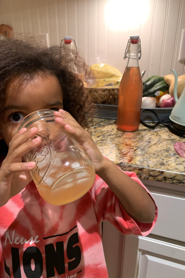 girl drinking water kefir your kids will love