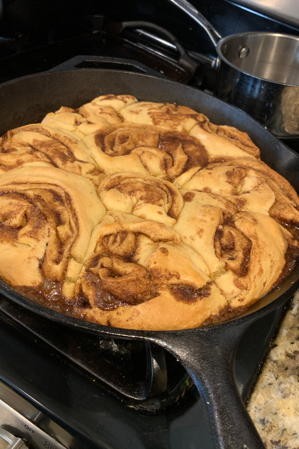Sourdough cinnamon rolls in cast iron skillet